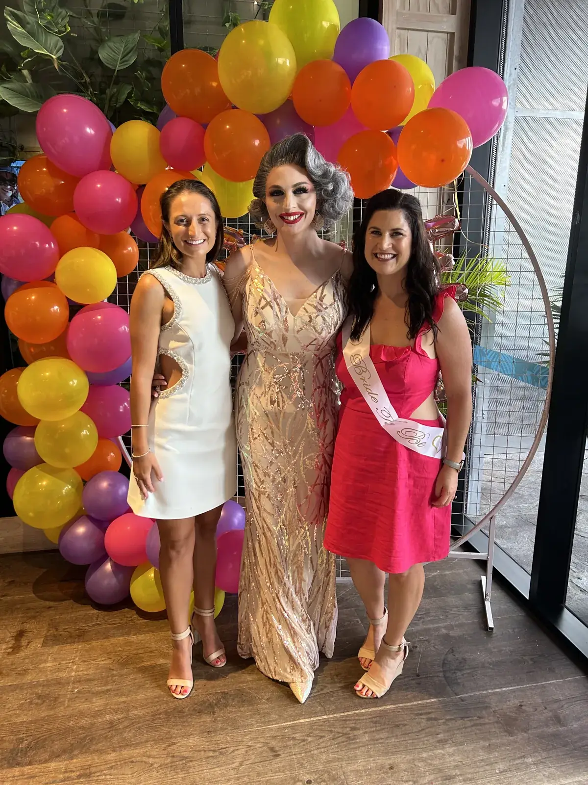 Hens party guests with a Syd Showgirls performer in Sydney
